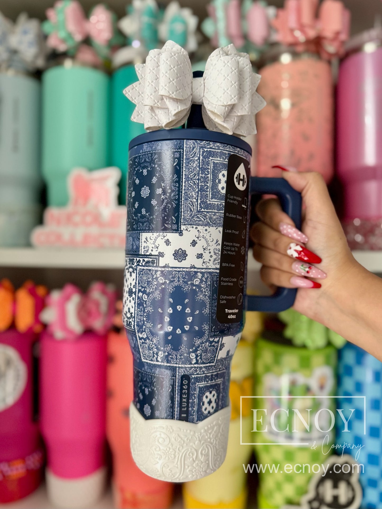 Aalijah Shimmer boot from the Ecnoy LUXE Collection — cream shimmer finish, scalloped edge, vintage-inspired floral embossed pattern — pictured on a HydroJug x Fabletics 40oz Traveler tumbler in Indigo Patchwork.