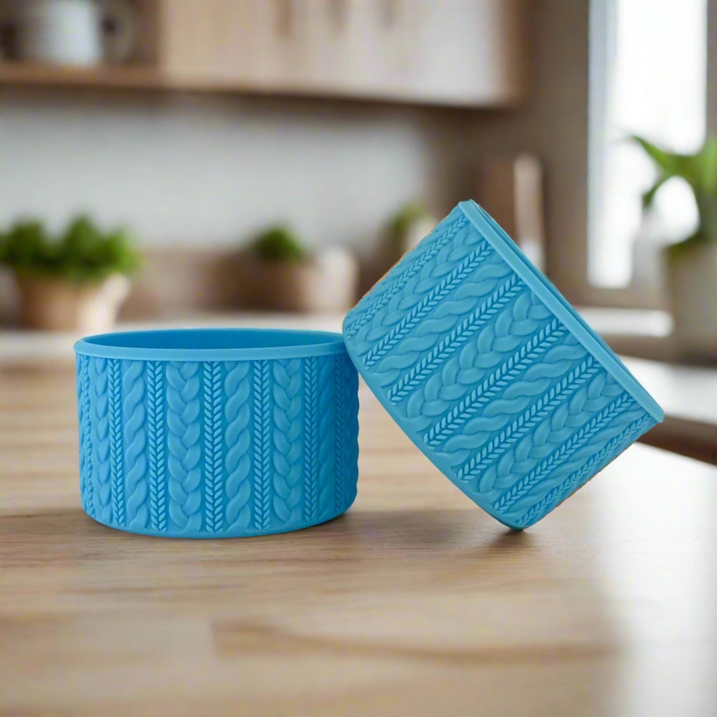 Rylie COZY cable-knit silicone tumbler boot in sky blue by Ecnoy & Company, two boots on a marble kitchen counter.